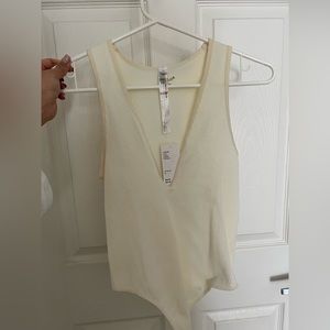 Plunge neck ribbed white bodysuit